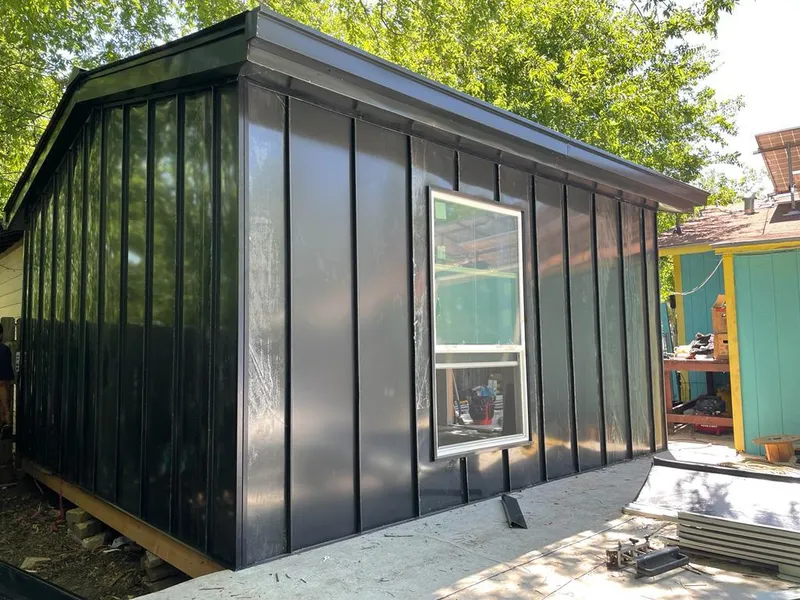 Black standing seam metal wall panels for Roof Inspection in Hornsby Bend