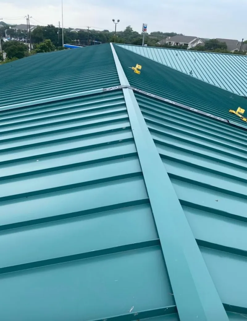 Green commercial metal roof ridge and valley for Metal Roof Repair in Hornsby Bend