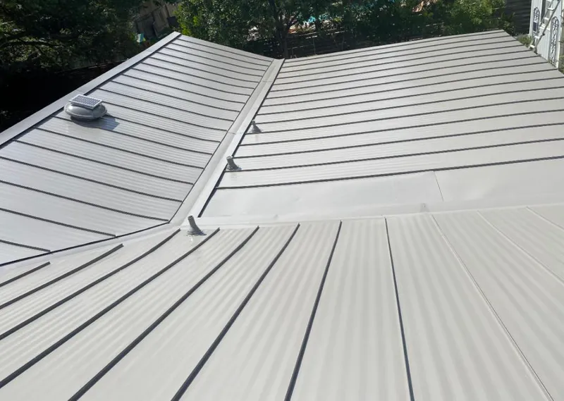 Solar attic fan installed on a metal roof for Roof Ventilation in Hornsby Bend